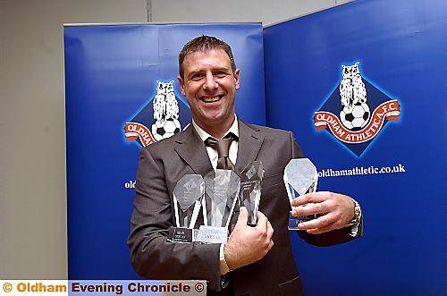 HANDFUL: Sean Gregan, Athletic’s outstanding player of the 2009/10 season, shows off his four awards. 