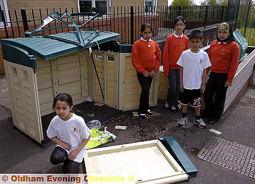 NOT fair... pupils (from left) Shanila Chowdhury, Sumayyab Bashir, Nafeesa Rashid, Zaria Nadeem and Azfar Al in the vandalised garden and (below) the sign on the wall, which welcomes visitors to the area 