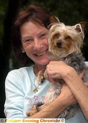 A DELIGHTED <b>Elaine Beswick</b> with her dog Jessica and (below) how we reported <b>...</b> - 201091_115244