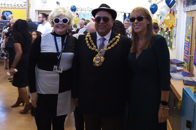 Woodhouses Primary head teacher Rachael Bentham (left) gets into the 60s spirit alongside the Mayor of Oldham Cllr Javid Iqbal (dressed as Kojak) and Ashton MP Angela Rayner