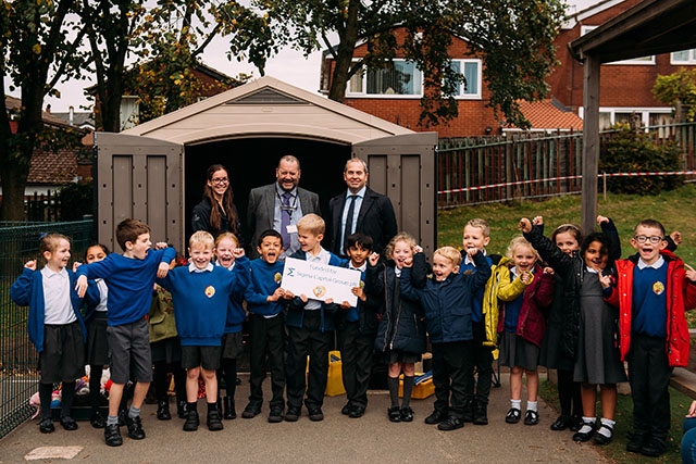 Pictured with school pupils are (left to right): Tiffany Chevis, Marketing Executive, Simple Life, Ian Mason, Headteacher, Mills Hill Primary School and Matthew Townson, Development Director, Simple Life.
