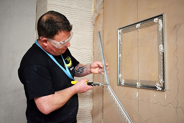 Stuart Smith learning plastering techniques at Hopwood Hall College