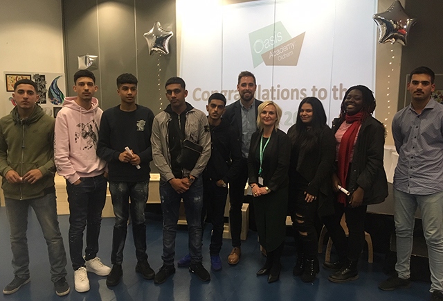 Ben Smith (centre) pictured with a group of Oasis Academy students during his visit