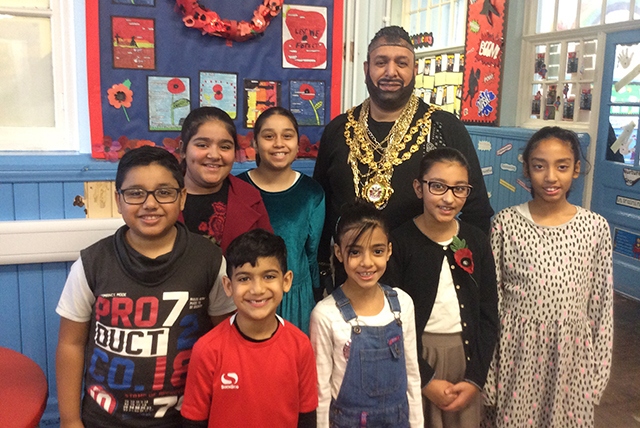 The Mayor of Oldham, dressed as Mr T, with pupils at Clarksfield Primary