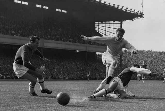 Colin Barlow (centre) in action playing for Manchester City