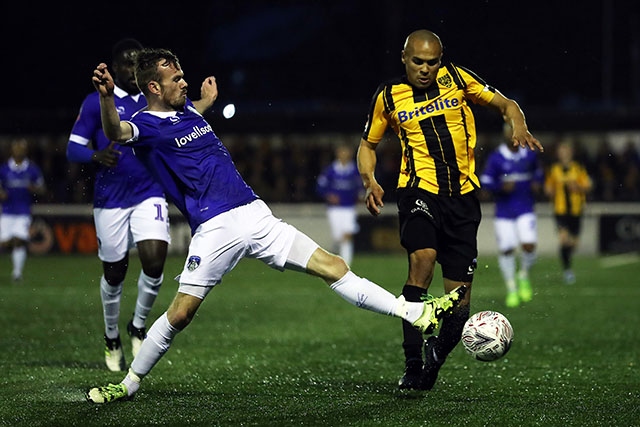 Action from Saturday's FA Cup win at Maidstone as Athletic's Cameron Dummigan (left) challenges Elliot Romain