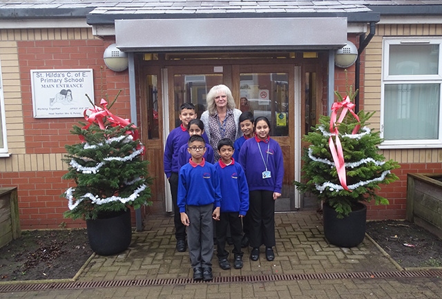 Mrs Pursey is pictured with St Hildas' junior management team and eco council