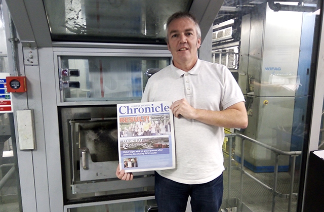 Oldham Chronicle Open Days supplement editor Simon Smedley picks up an edition hot off the press yesterday