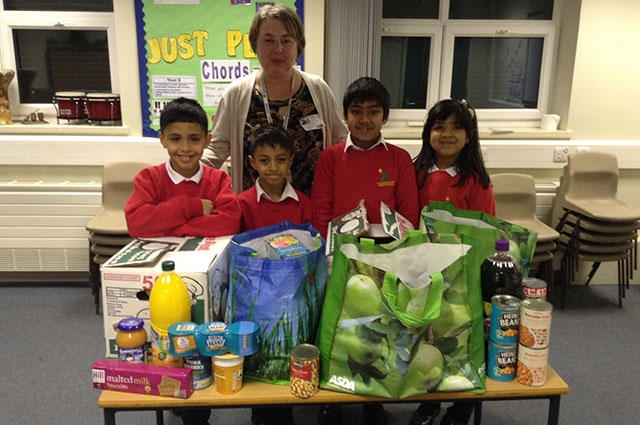 Umar, Muhammed Ali, Alishba and Ayaan with some of the Foodbank offerings