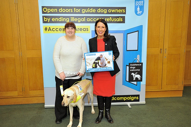 MP Debbie Abrahams met Laura with her guide dog Jimmy, who is a yellow Labrador retriever, at a special launch of Guide Dogs' Access All Areas campaign in Parliament