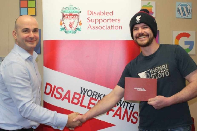 Oldham business gives Liverpool FC Disabled Supporters Association a boost