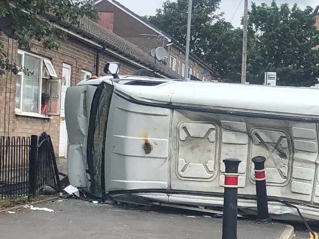 The van overturned at around lunchtime, forcing the road to be closed in both directions