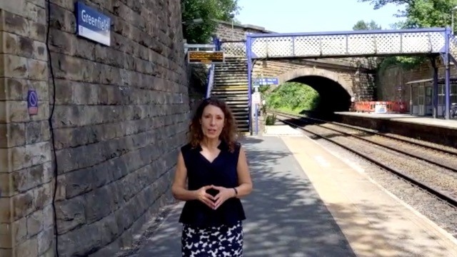 Debbie at Greenfield station outside the building where the original path was situated.