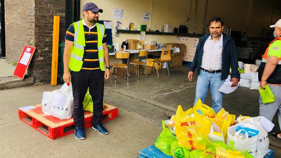 Oldham's Ahmadiyya Muslim Community volunteers are pictured preparing the food parcels