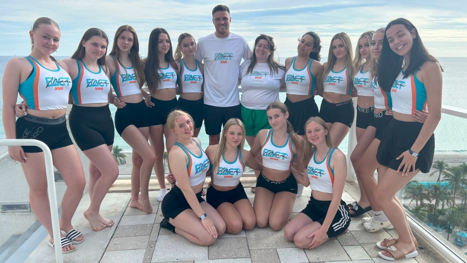 The dancers performed alongside official Dolphins cheerleaders