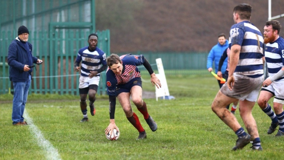 Oldham's Tom Davies goes over for a try