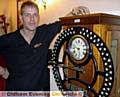 Time please . . . landlord Andy Thornton stands next to his �clocking in� machine 