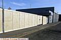 HOARDINGS go up around the unfinished Royton Assembly Hall 