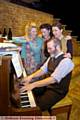 WAR-TIME songs . . . from left, Anna Doolan, Laura Norton, Katherine Dow Blyton, with Simeon Truby on the piano 