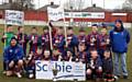 TROPHY TIME: Players and management from Heyside JFC under-11s celebrate League Cup glory at Hurst Cross. 