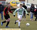 Stephen Humphries (centre), of Shaw Stars under-13s, is pursued by Chadderton Juniors FC�s Adam Marsden.