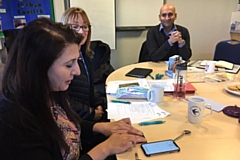 Founder of the Women’s CHAI Project, Najma Khalid, is shown how to use the AF detection devices with Health Innovation Manchester
