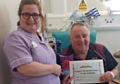 Royal Oldham Hospital Health Care Assistant Lesley Noon with patient Philip Hargreaves