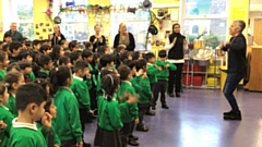 Poet Andy Tooze pictured with the Greenacres Primary Academy children