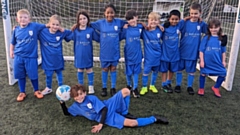 The football team at Royton Hall Primary School show off their new kits