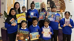 Charlotte Brown, English Lead Teacher at Northmoor Academy, is pictured with Author and Founder of Children’s Literature Festivals charity Christina Gabbitas and some of the school's pupils