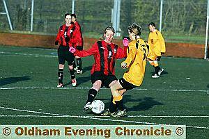 UNDER CONTROL: Louise Grieve (left) attemps to side-step a Middleton Colts challenge. 
