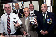 PROUD moment . . . with their badges are, from left, Anthony Cooke, Ken Stonestreet, Ronald Murray, John Higgins and Tommy Buxton 