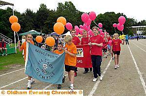 HOW IT WAS . . . last year’s Saddleworth Olympics started with a parade of athletes 