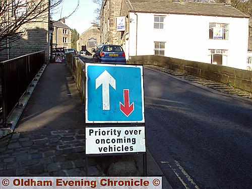 Bridge of signs . . . the temporary sign on the King Street side of Delph bridge 