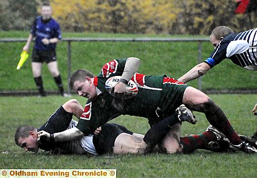 OUCH: Danny Rouse (Castleford Lock Lane) is pinned to the turf by Waterhead’s Will Schofield in their National Conference Division 2 clash which the Yorkshire visitors won 24-8. 