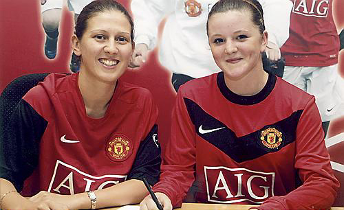 SIGN HERE: Chloe Wild puts pen to paper alongside Manchester United’s girls development officer Emma Gaynon, the former Curzon Ladies player from Shaw. 