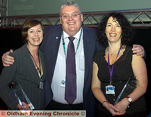 HERE come the girls . . . council leader Howard Sykes with winners Lynn Phillips, left, customer service award and Ann-Marie McGinn who scooped the working together for Oldham award 