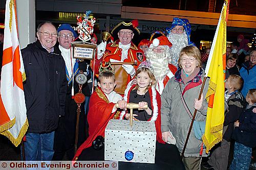 LIGHTING up Chadderton . . . Daniel Lane and Charlotte Savage push the plunger 