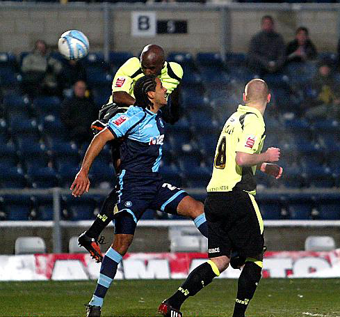 DEFENDER Reuben Hazell climbs above Wycombe Wanderers centre-back Chris Westwood to nod Athletic ahead. 