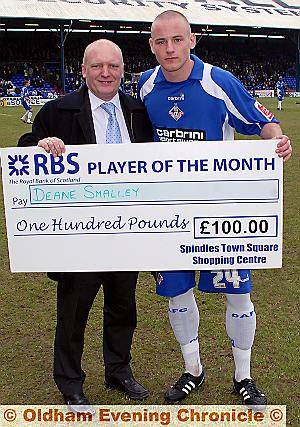 IT’S YOURS: Deane Smalley was voted January’s player-of-the-month and here he is receiving his cheque for £100 from Mike Flanagan, manager of Spindles and Town Square Shopping Centre, who sponsor the award. 