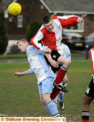 TWO-GOAL Ryan Johnson (left), of Failsworth Dynamos under-14s, is beaten to the ball. 