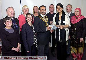 Launch of mental health charity MIND in Oldham. Back row l-r, Cllr. Brian Lord, Theresa Ibbotson (Care and Family Support worker), Gemma Wynne-Jones (Independent Mental Health Advocate), Richard Edwards (director MIND), Keith Holloway (asst. director NHS Oldham). Front row l-r, Cllr. Jean Jones, Gail Richards (chief exec. NHS Oldham), Mayor Cllr. Shoab Akhtar, Fozia Amin (MIND Oldham services manager), Mayoress Shafeena Kaus 