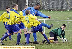 McIntosh crashes home Oldham Schools under-14s’ second goal against Bury. 