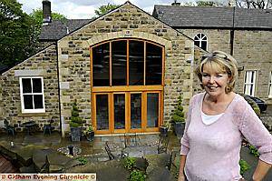 THE Old Vicarage . . . Barbara Arthurs shows off the award-winning extension at her home in Dobcross 
