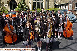 ON song . . . three of Crompton House School’s music groups are heading to a prestigious national festival. Pictured are members of the groups, including (front, from the left) Megan Lord from the school orchestra, Leanne Hutchinson from the brass band and Samantha Wright from the swing band 