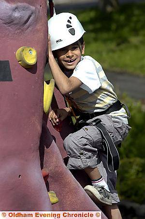 HEAD for heights . . . Anas Mohammed (7) hangs on as he gets to the top 