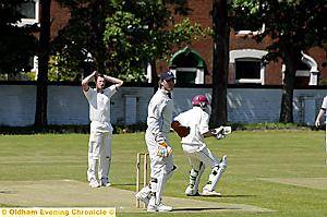 NOT THIS TIME: Werneth captain Andy Walker survives a chance off Lee Grogan. PICTURES by CHRIS SUNDERLAND 