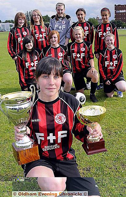 ROCS FC Under 14s team: Captain Georgia Flynn with the League and Cup trophies 