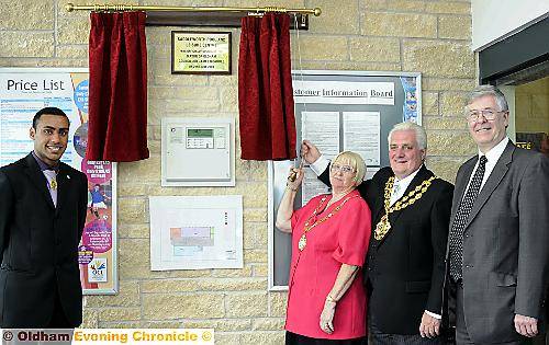 The Mayor, Councillor Jim McArdle, and Saddleworth Parish Council chairman, Councillor Alma McInnes, are pictured pulling the cord to unveil the plaque, watched by youth mayor Mohammed Adil and Councillor John McCann, Cabinet member for Community Services and Housing. 