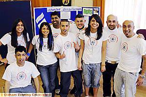 Anjum Raza (right) and his wife, Bharti (third from the right), with fellow supporters of Oldham Deaf Diverse Community at its open day 